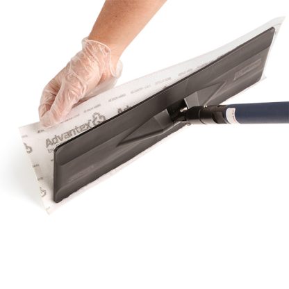 Hand detaching an Advantex Microfiber Disposable Mop from the mop head